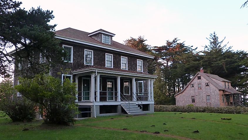 The barracks/office building on the left and the officer-in-charge residence on the right of the former Port Orford Coast Guard Station in Port Orford, Oregon, United States.