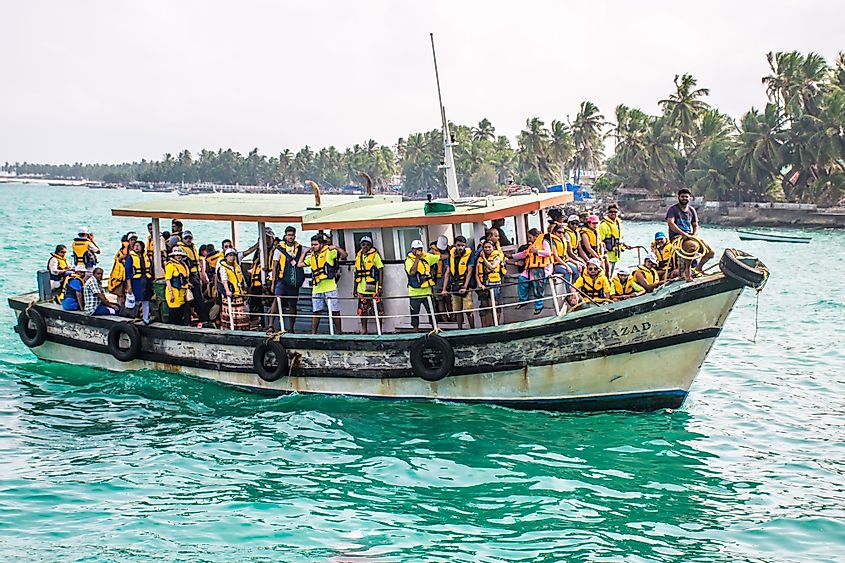 Passengers traveling to Minicoy Island in a fishing boat in Lakshadweep, India.