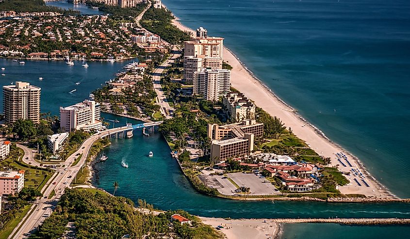 aerial view of boating inlet from atlantic ocean to intracoastal waterway at boca raton florida community