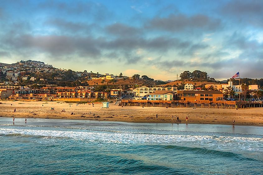 Sun setting on Pismo Beach Pier in Pismo Beach, California