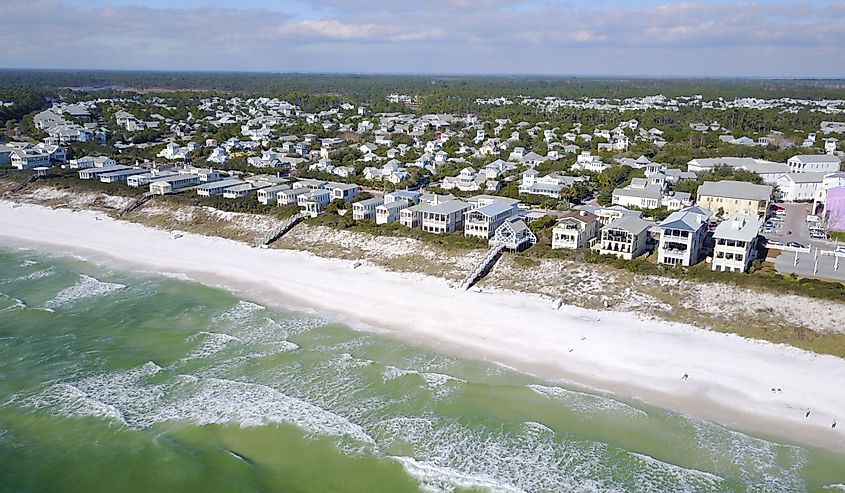 Beachfront homes in town of Seaside, Florida, seen in 4K aerial flyover from waters of Gulf of Mexico