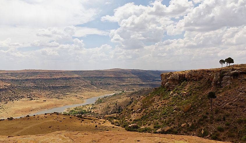 The Caledon River passing through arid Landscape Ficksburg South Africa.