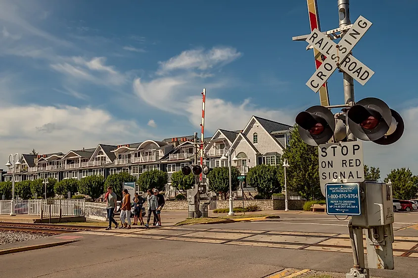 People wait to cross train tracks in New Buffalo, Michigan