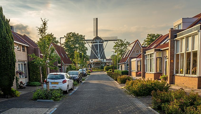 Traditional dutch windmill "De Oelemölle" seen from the residential neighborhood in Hardenberg, Netherlands. 