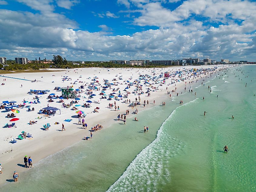 Beachgoers enjoying a sunny day on Siesta Key Beach, via Felix Mizioznikov / Shutterstock.com