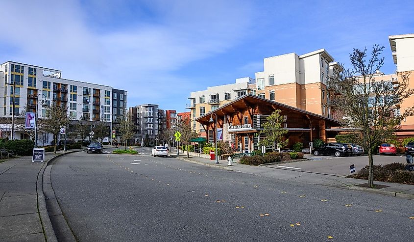 Downtown Mercer Island, curved street with modern buildings on both sides and a Starbucks coffee shop