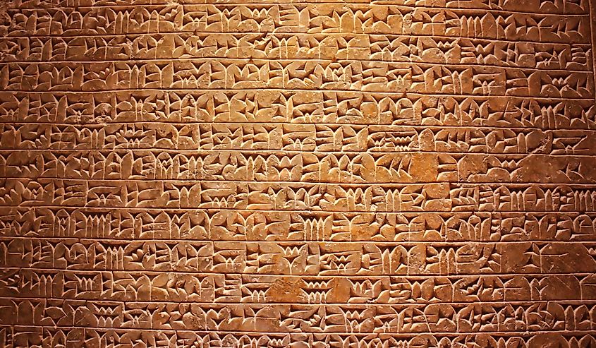 Ancient cuneiform writing script on the wall