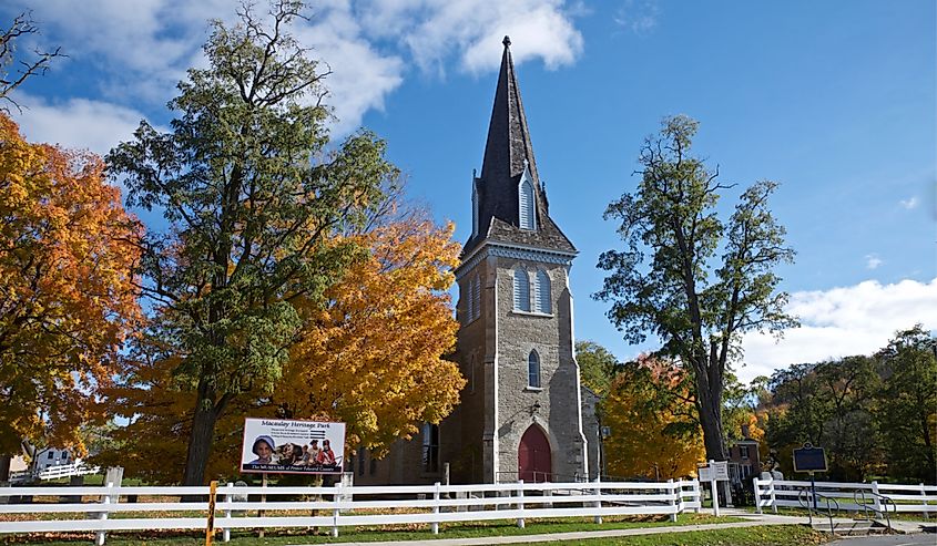 Historic Heritage Catholic Church building exterior with autumn leaf colour