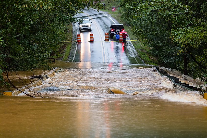 Waxhaw, North Carolina - September 16, 2018: Motorists inspect a road flooded by rain from Hurricane Florence