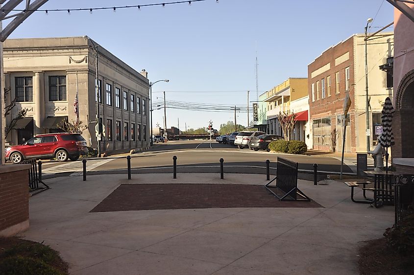 Bankhead Street in New Albany, Mississippi's downtown business and historic district, lined with shops and center parking.