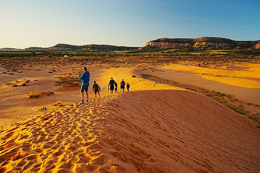 Visitors enjoying the dune scenery at the Coral Pink Sand Dunes State Park, Utah