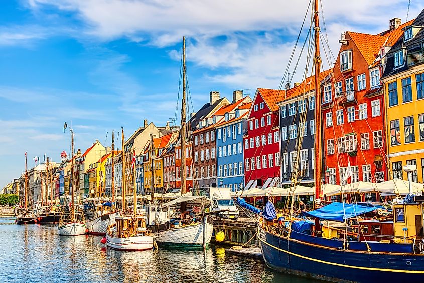 Famous old Nyhavn port in the center of Copenhagen, Denmark during summer sunny day.