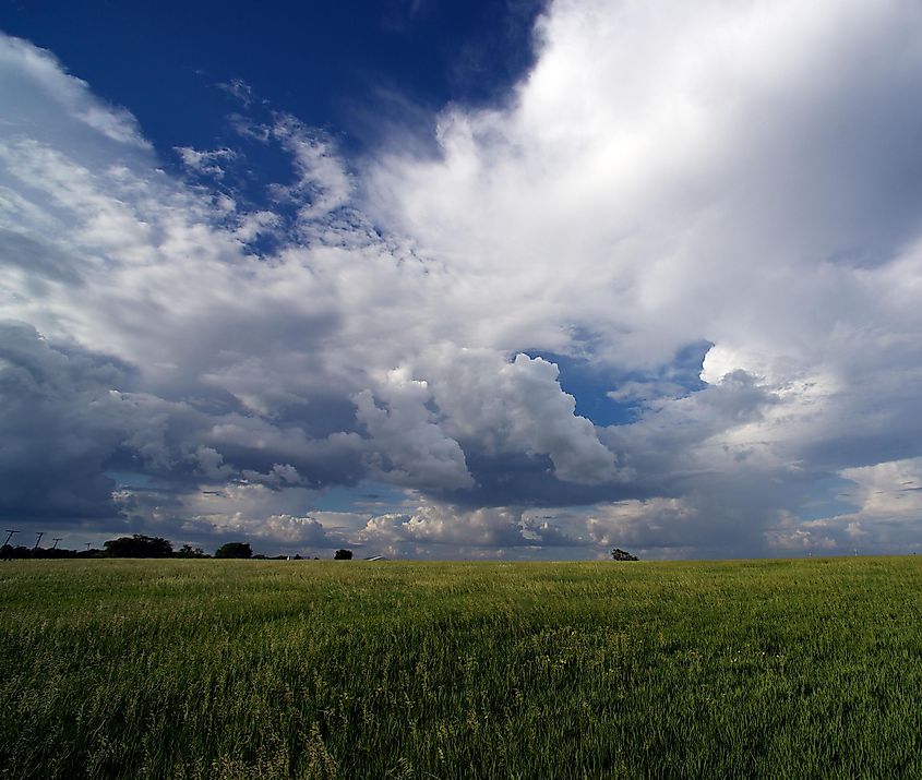 Rain clouds forming over corn fields near Osawatomie, Kansas. Editorial credit: mark reinstein / Shutterstock.com