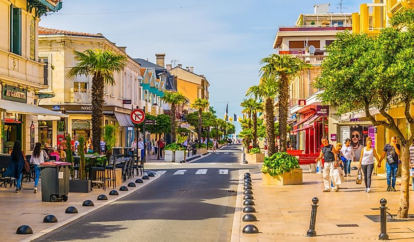 Main pedestrian alley leading to a beach in the historical center of Arcachon, France