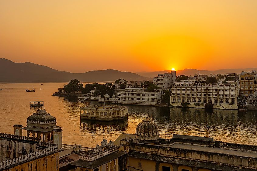 The sun sets over Lake Pichola in Udaipur.