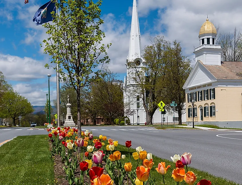 View of the historic and colorful Manchester Village in Manchester, Vermont with tulips in bloom.