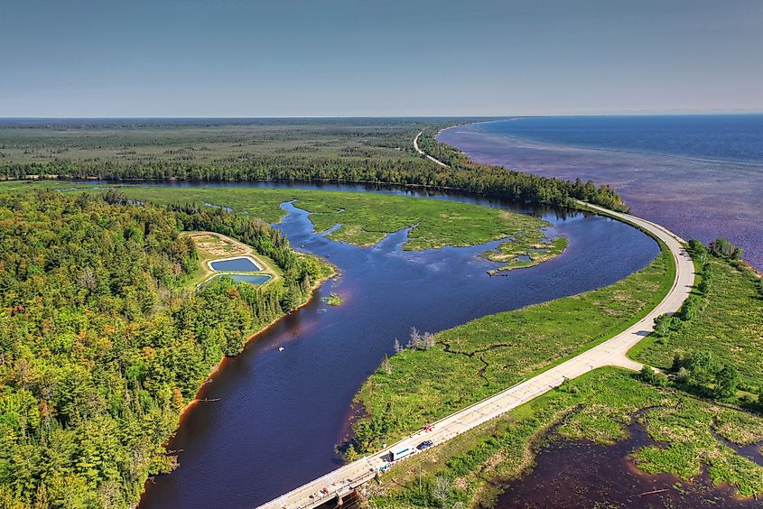 View looking north at Emerson Corner, Michigan, with the Tahquamenon River near its outlet to Lake Superior, and Highway M-123 on the right.