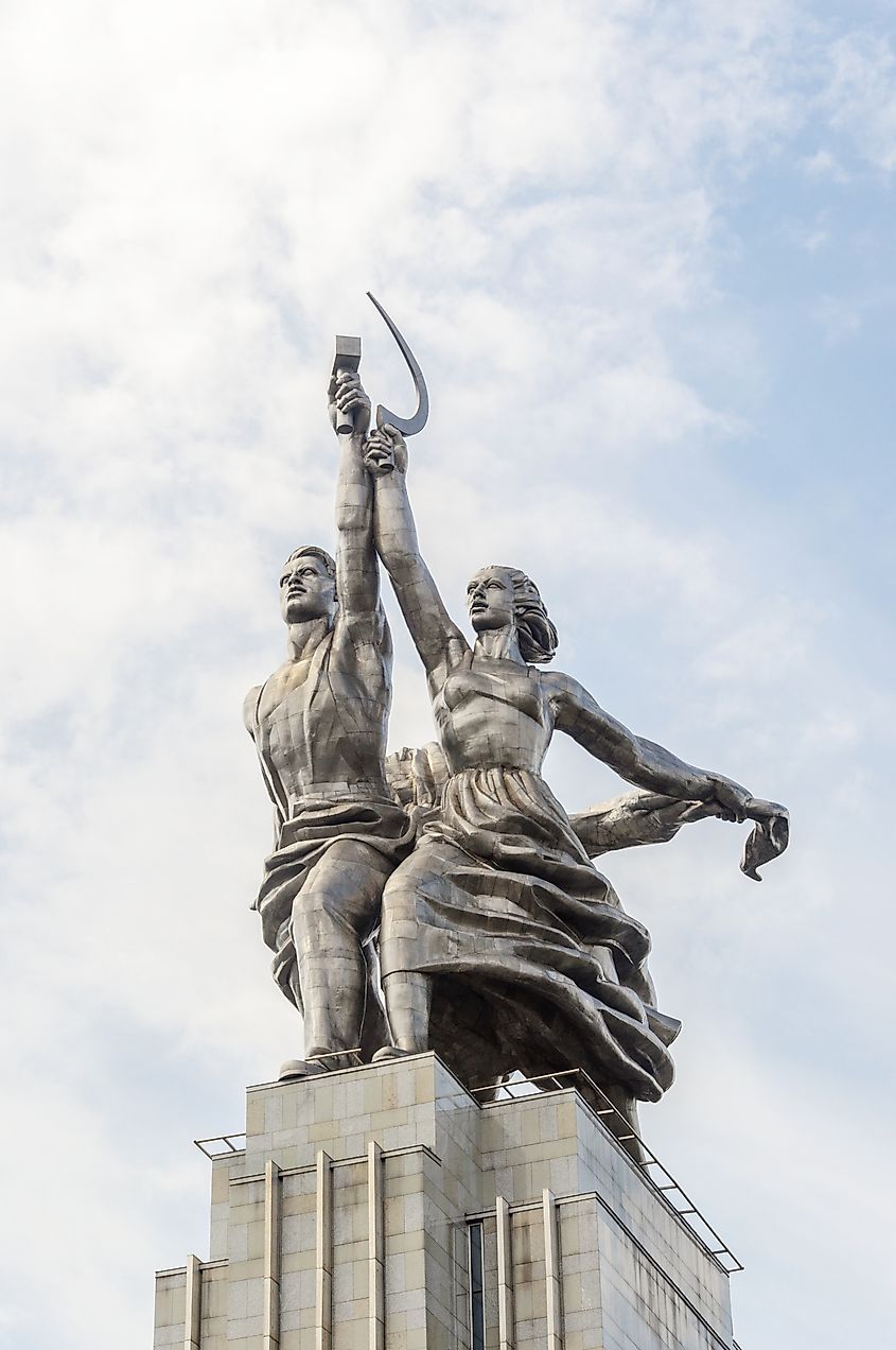 "Worker and Kolkhoz Woman" by artist Vera Mukhina depicting two figues carrying a hammer and sickle.