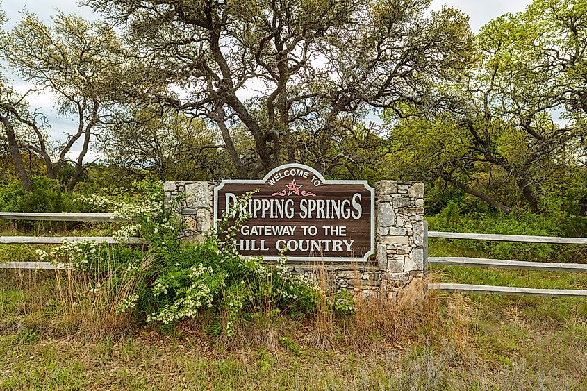Welcome to Dripping Springs sign from this small town in the Texas Hill Country.