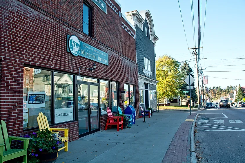 Colorful Adirondack chairs outside the Morrisville Municipal Offices in Morrisville, Vermont on a sunny autumn afternoon