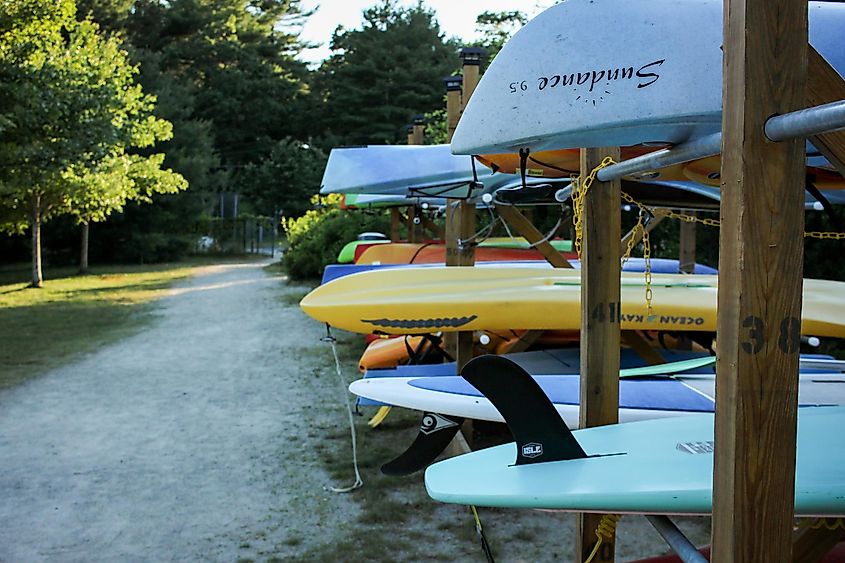 Canoes and kayaks docked by Lake Massapoag in Sharon, Massachusetts. Editorial credit: emmavgerard / Shutterstock.com