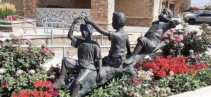 Sculptures of children playing in Brighton, Colorado.