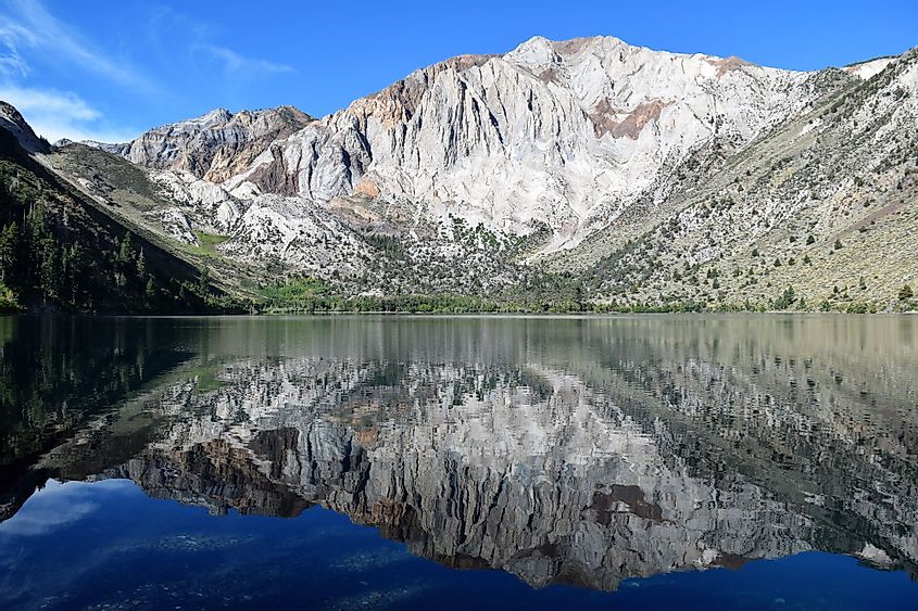 Mount Morrison mirrored in placid blue lake at Convict Lake, California