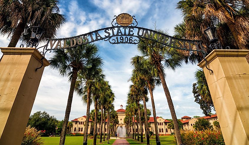 Front gateway lined with palm trees at Valdosta State University in Valdosta