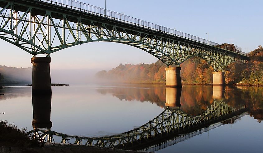 The Kennebec River Rail Trail in autumn with the Kennebec Memorial Bridge.