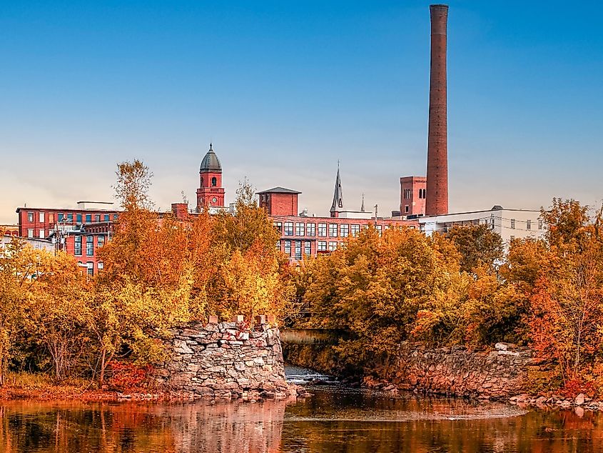 Old factory city in Autumn, Lewiston, Maine clear sky