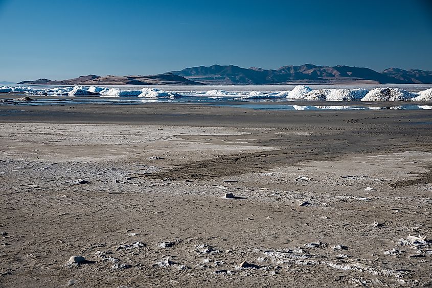 The vanishing Great Salt Lake with salt mounds in the near distance