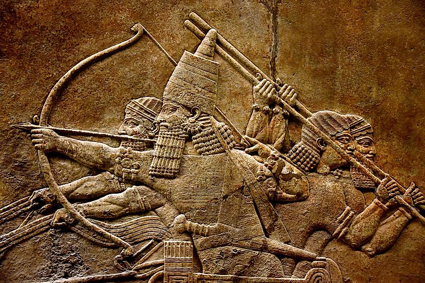 Relief depicting Ashurbanipal in a chariot, armed with a bow.