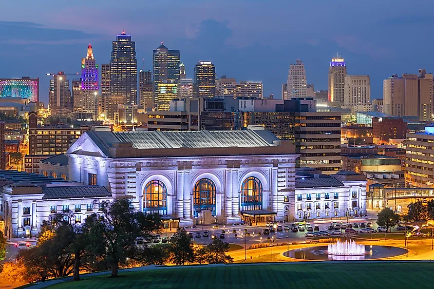 Kansas City, Missouri, Union Station in front of the Kansas City downtown skyline, at dusk.