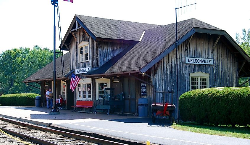 The train station with two people on the platform.