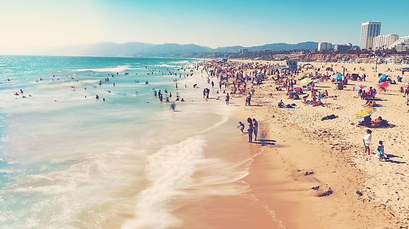 People visit a beach in Santa Monica, California