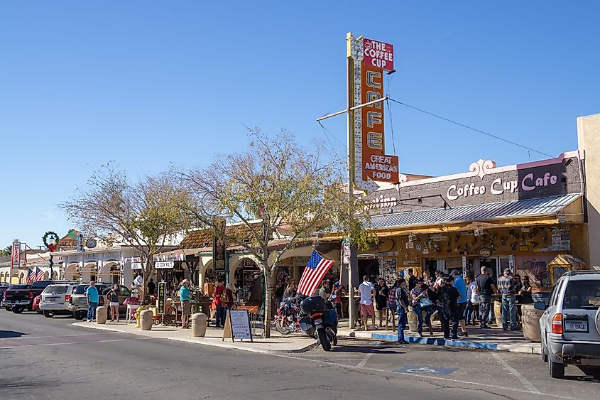 Bustling center of Boulder City, Nevada, with a variety of cafes and restaurants, capturing the town's lively atmosphere.