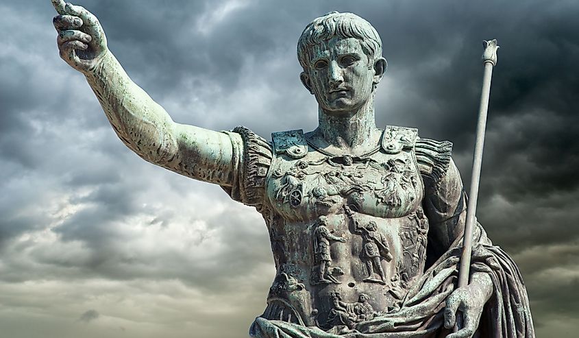Rome, Italy, Bronze statue of Emperor Augustus (Gaius Iulius Cæsar Octavianus Augustus) on a stormy sky background.