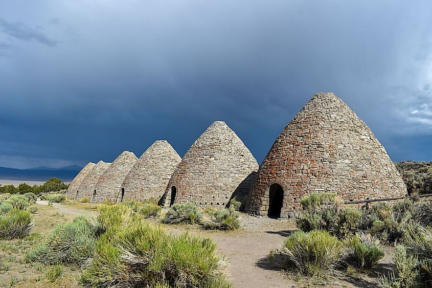 Angled sunny views of the six beehives at Ward Charcoal Ovens State Historic Park. 
