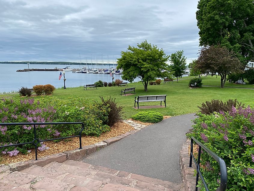 A well groomed waterfront park on an overcast day.