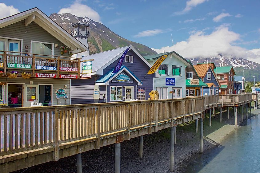 Shops along the dock in Seward Harbor in Resurrection Bay in Seward, Alaska, via Raisa Nastukova / Shutterstock.com