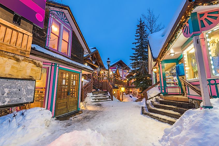 Breckenridge, Colorado, USA downtown streets at night in the winter with holiday lighting.