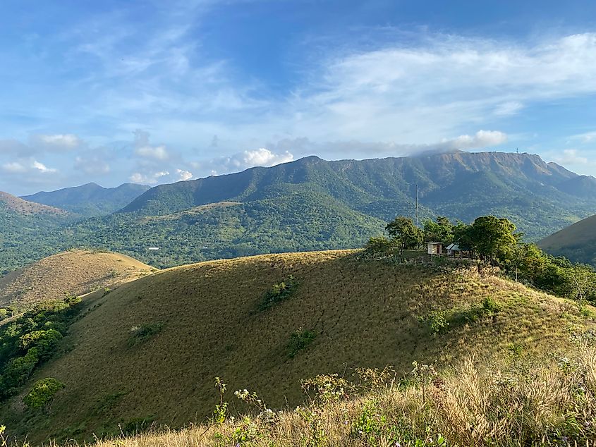 A green, mountainous landscape as seen from atop a minor mountain on Busuanga Island.