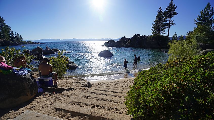 People enjoying the end of summer at the beach. Photo taken at Sand Harbor State Park in Lake Tahoe over the Labor Day weekend, via 1000Photography / Shutterstock.com