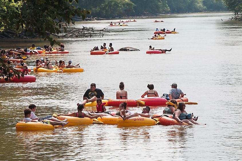 visitors floating down the Chattahoochee River on rafts and innertubes