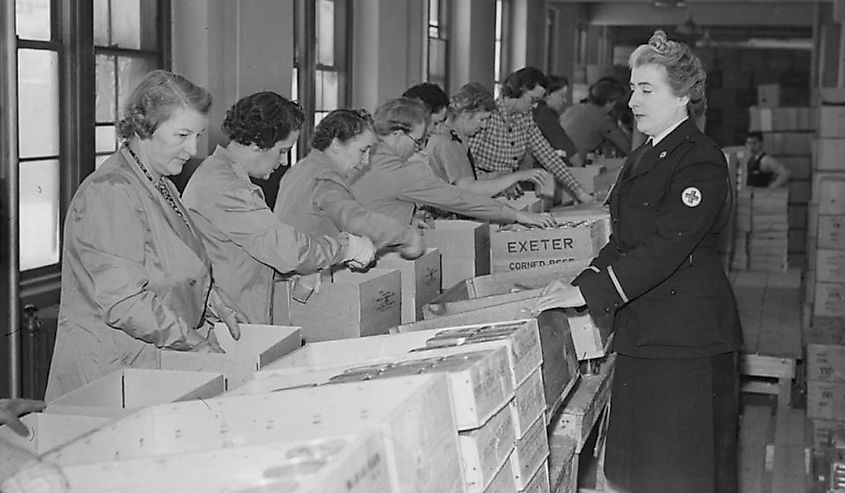 Women volunteers of the Canadian Society of the Red Cross prepare packages that will be sent to prisoners of war.