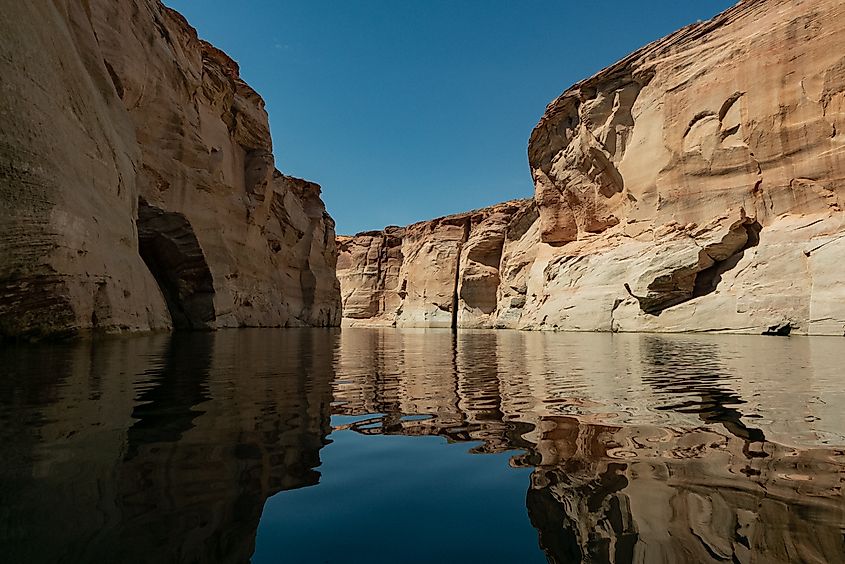 Reflections of sandstone Glen canyon walls on Lake Powell