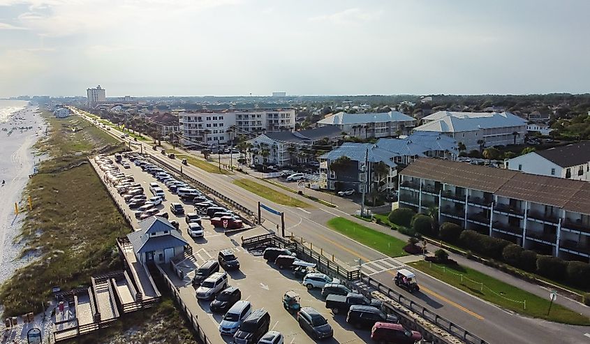 Aerial 98 Scenic Gulf Drive, Regional Access to Miramar Beach, full public parking, white sandy shoreline near multiple story condominium, apartment, vacation rental neighborhood. Walton, Florida