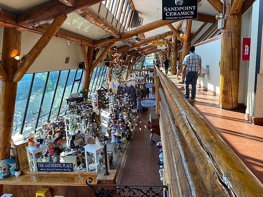 A large, two-story flea market inside a wooden with big sunny windows.