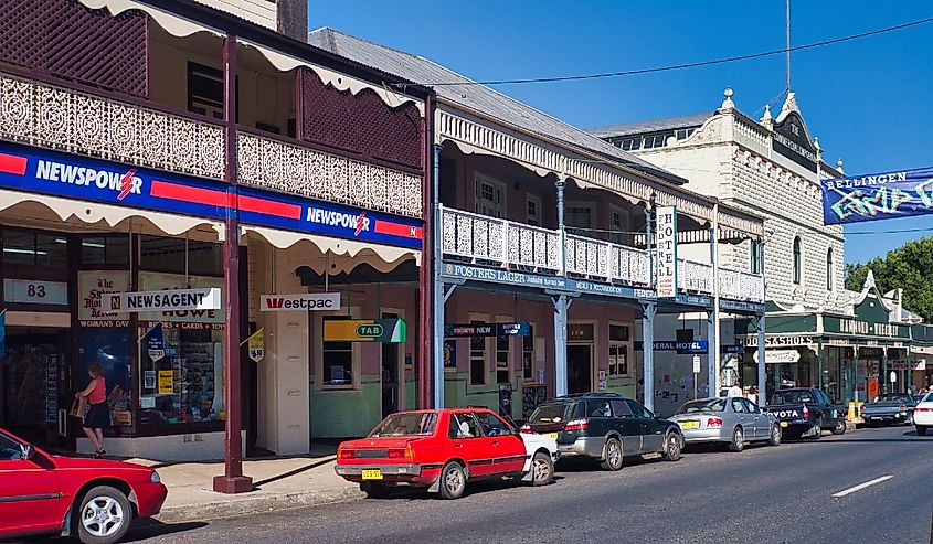 The architecture of covered walkways, arches, and wrought iron decorative balconies in Bellingen. 