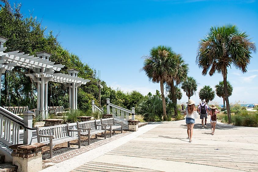 Family walking to the beach on summer vacation at Coligny Beach Park, Hilton Head Island, South Carolina, USA.